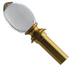 A gold colored glass object with a clear glass top. AI generated content